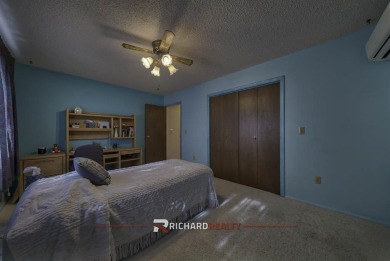 Step into this charming, expansive one-story brick home nestled on Olive Glenn Golf and Country Club in Wyoming - for sale on GolfHomes.com, golf home, golf lot