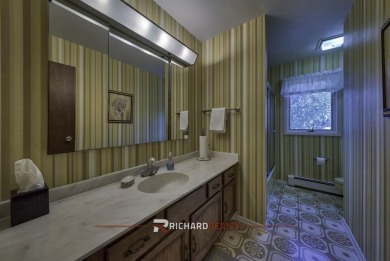 Step into this charming, expansive one-story brick home nestled on Olive Glenn Golf and Country Club in Wyoming - for sale on GolfHomes.com, golf home, golf lot