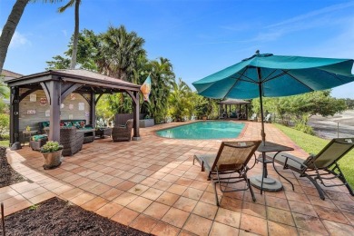 Unforgettable 5-bed, 3-bath gem at the end of a quiet cul-de-sac on Jacaranda Golf Club in Florida - for sale on GolfHomes.com, golf home, golf lot