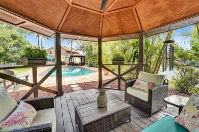 Unforgettable 5-bed, 3-bath gem at the end of a quiet cul-de-sac on Jacaranda Golf Club in Florida - for sale on GolfHomes.com, golf home, golf lot