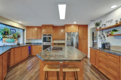 Unforgettable 5-bed, 3-bath gem at the end of a quiet cul-de-sac on Jacaranda Golf Club in Florida - for sale on GolfHomes.com, golf home, golf lot