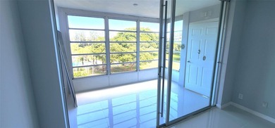 Spacious Remodel VERY BRIGHT Golf and Pool view Partial Impact on Palm-Aire Country Club and Resort - The Oaks in Florida - for sale on GolfHomes.com, golf home, golf lot