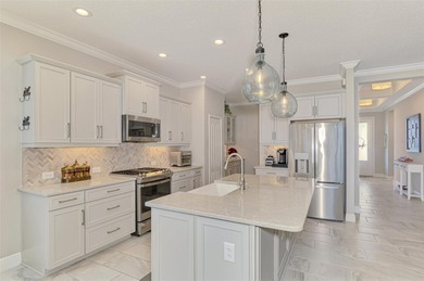 Some homes project confidence the moment you pull up. This one on Boca Royale Golf and Country Club in Florida - for sale on GolfHomes.com, golf home, golf lot