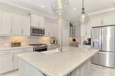 Some homes project confidence the moment you pull up. This one on Boca Royale Golf and Country Club in Florida - for sale on GolfHomes.com, golf home, golf lot