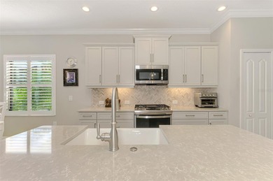 Some homes project confidence the moment you pull up. This one on Boca Royale Golf and Country Club in Florida - for sale on GolfHomes.com, golf home, golf lot