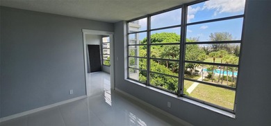 Spacious Remodel VERY BRIGHT Golf and Pool view Partial Impact on Palm-Aire Country Club and Resort - The Oaks in Florida - for sale on GolfHomes.com, golf home, golf lot