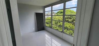 Spacious Remodel VERY BRIGHT Golf and Pool view Partial Impact on Palm-Aire Country Club and Resort - The Oaks in Florida - for sale on GolfHomes.com, golf home, golf lot