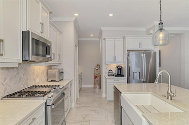 Some homes project confidence the moment you pull up. This one on Boca Royale Golf and Country Club in Florida - for sale on GolfHomes.com, golf home, golf lot