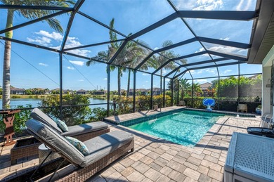 Some homes project confidence the moment you pull up. This one on Boca Royale Golf and Country Club in Florida - for sale on GolfHomes.com, golf home, golf lot