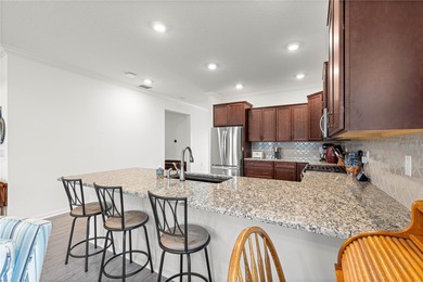 This upgraded Orchid model is located in the desirable Weybourne on Candler Hills Golf and Country Club in Florida - for sale on GolfHomes.com, golf home, golf lot