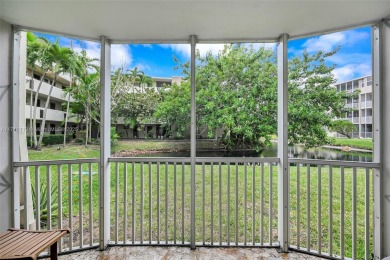 Discover the perfect first-floor corner unit with a tranquil on Presidential Estate Golf Course in Florida - for sale on GolfHomes.com, golf home, golf lot