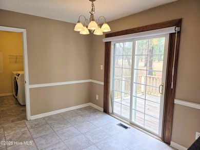 Loads of value in this inviting home backing to River Bend Golf on River Bend Golf and Country Club in North Carolina - for sale on GolfHomes.com, golf home, golf lot