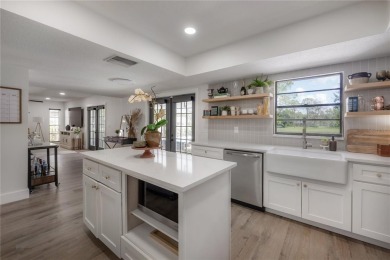 Welcome Home! This 4-bedroom, 2.5-bath home has been on Northdale Golf and Tennis Club in Florida - for sale on GolfHomes.com, golf home, golf lot