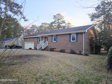 Loads of value in this inviting home backing to River Bend Golf on River Bend Golf and Country Club in North Carolina - for sale on GolfHomes.com, golf home, golf lot