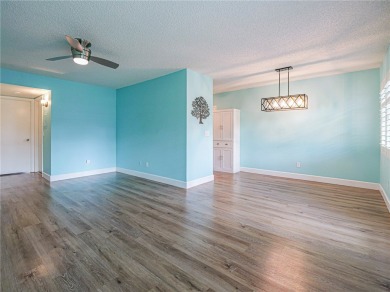 First Floor! Beautiful plank laminate floors w/ newer baseboard on Vero Beach South Golf Course in Florida - for sale on GolfHomes.com, golf home, golf lot