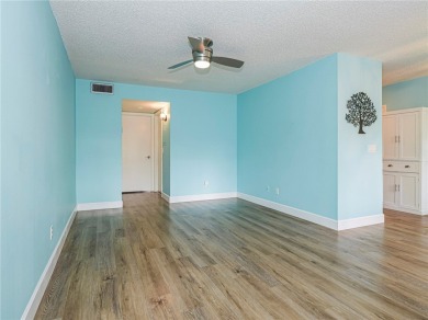 First Floor! Beautiful plank laminate floors w/ newer baseboard on Vero Beach South Golf Course in Florida - for sale on GolfHomes.com, golf home, golf lot