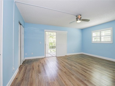 First Floor! Beautiful plank laminate floors w/ newer baseboard on Vero Beach South Golf Course in Florida - for sale on GolfHomes.com, golf home, golf lot
