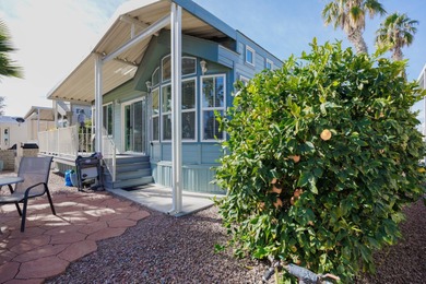 Wake up to breathtaking golf course views on Hole 14, where lush on Palm Creek Golf and RV Resort in Arizona - for sale on GolfHomes.com, golf home, golf lot