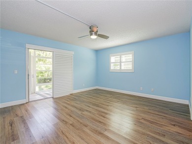 First Floor! Beautiful plank laminate floors w/ newer baseboard on Vero Beach South Golf Course in Florida - for sale on GolfHomes.com, golf home, golf lot