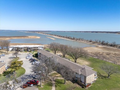 LUXURIOUS LAKEFRONT CONDO IN RUNAWAY BAY - Unbeatable Location & on The Club At Runaway Bay in Texas - for sale on GolfHomes.com, golf home, golf lot