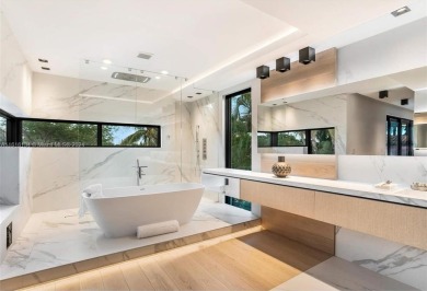 Contemporary Villa with modern finishes throughout and cozy on Miami Beach Golf Club in Florida - for sale on GolfHomes.com, golf home, golf lot