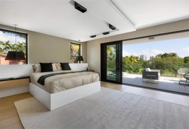 Contemporary Villa with modern finishes throughout and cozy on Miami Beach Golf Club in Florida - for sale on GolfHomes.com, golf home, golf lot