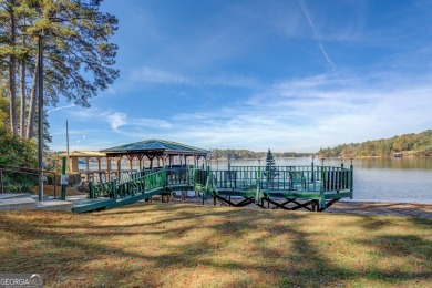 Panoramic big water views from this charming DEEDED lakefront on Turtle Cove Golf Course in Georgia - for sale on GolfHomes.com, golf home, golf lot