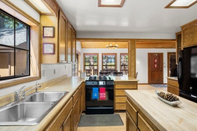 Inviting Four-Bedroom Clerestory Cabin in Blue Lake Springs on Sequoia Woods Country Club in California - for sale on GolfHomes.com, golf home, golf lot