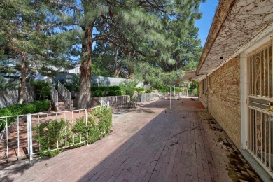 This HOME draws you in with a long driveway and gorgeous, fully on The Canyon Club in New Mexico - for sale on GolfHomes.com, golf home, golf lot