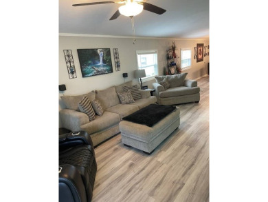 Location with stunning views of the golf course and waterpletely on Del Tura Golf and Country Club in Florida - for sale on GolfHomes.com, golf home, golf lot