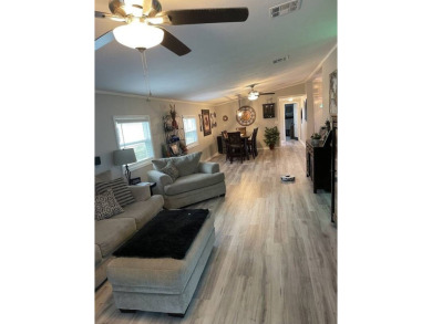 Location with stunning views of the golf course and waterpletely on Del Tura Golf and Country Club in Florida - for sale on GolfHomes.com, golf home, golf lot