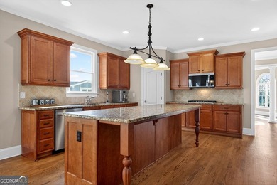 Located in BridgeMill, this well-maintained home offers the on Bridgemill Golf Club in Georgia - for sale on GolfHomes.com, golf home, golf lot