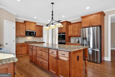 Located in BridgeMill, this well-maintained home offers the on Bridgemill Golf Club in Georgia - for sale on GolfHomes.com, golf home, golf lot