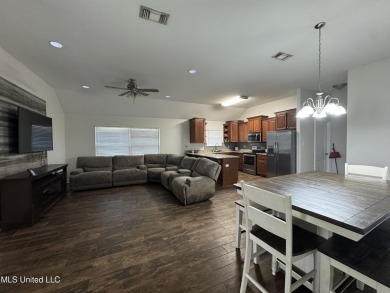 Don't miss out on this perfect home next to the serene Twin on Diamondhead Country Club in Mississippi - for sale on GolfHomes.com, golf home, golf lot