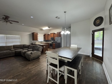 Don't miss out on this perfect home next to the serene Twin on Diamondhead Country Club in Mississippi - for sale on GolfHomes.com, golf home, golf lot