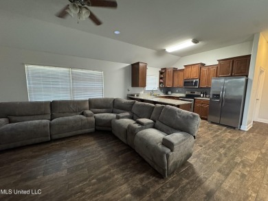 Don't miss out on this perfect home next to the serene Twin on Diamondhead Country Club in Mississippi - for sale on GolfHomes.com, golf home, golf lot