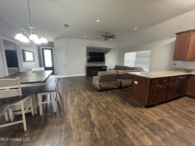 Don't miss out on this perfect home next to the serene Twin on Diamondhead Country Club in Mississippi - for sale on GolfHomes.com, golf home, golf lot