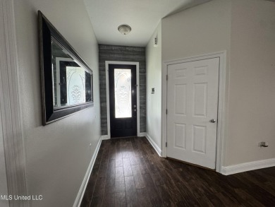 Don't miss out on this perfect home next to the serene Twin on Diamondhead Country Club in Mississippi - for sale on GolfHomes.com, golf home, golf lot