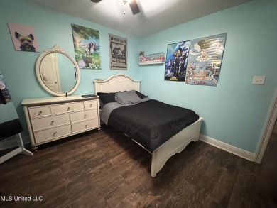 Don't miss out on this perfect home next to the serene Twin on Diamondhead Country Club in Mississippi - for sale on GolfHomes.com, golf home, golf lot