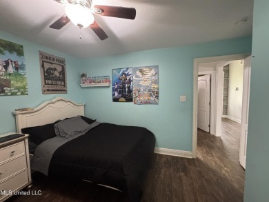 Don't miss out on this perfect home next to the serene Twin on Diamondhead Country Club in Mississippi - for sale on GolfHomes.com, golf home, golf lot