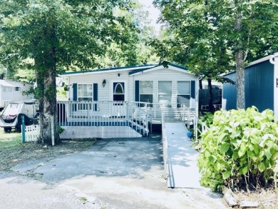 Welcome to your peaceful getaway! Located in The Holiday Out RV on Lake Tansi Village Country Club in Tennessee - for sale on GolfHomes.com, golf home, golf lot
