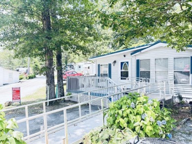 Welcome to your peaceful getaway! Located in The Holiday Out RV on Lake Tansi Village Country Club in Tennessee - for sale on GolfHomes.com, golf home, golf lot