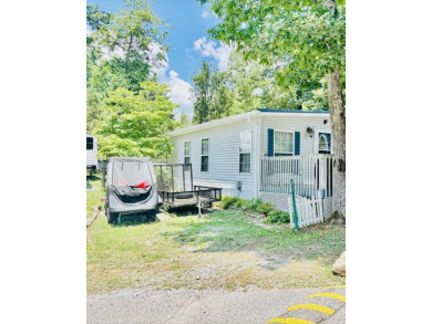 Welcome to your peaceful getaway! Located in The Holiday Out RV on Lake Tansi Village Country Club in Tennessee - for sale on GolfHomes.com, golf home, golf lot