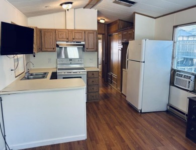 Welcome to your peaceful getaway! Located in The Holiday Out RV on Lake Tansi Village Country Club in Tennessee - for sale on GolfHomes.com, golf home, golf lot