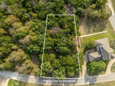 Serenity awaits!  At just over .25 acre, this beautifully wooded on White Bluff Resort - Old Course in Texas - for sale on GolfHomes.com, golf home, golf lot