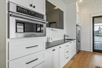 Introducing a RARE opportunity for luxury lakefront living and on Eagles Bluff Golf Course in Texas - for sale on GolfHomes.com, golf home, golf lot