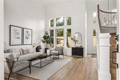 Nestled in a secure gated community within walking distance to on Tustin Ranch Golf Club in California - for sale on GolfHomes.com, golf home, golf lot
