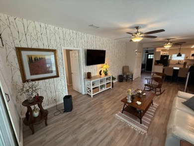 This beautifully updated stucco home is located only steps to on Del Tura Golf and Country Club in Florida - for sale on GolfHomes.com, golf home, golf lot
