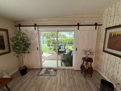This beautifully updated stucco home is located only steps to on Del Tura Golf and Country Club in Florida - for sale on GolfHomes.com, golf home, golf lot