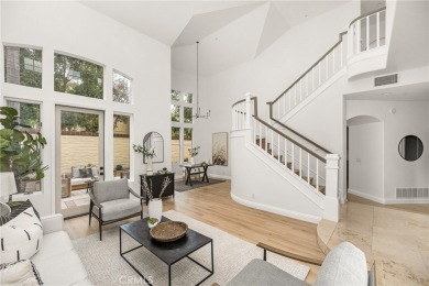 Nestled in a secure gated community within walking distance to on Tustin Ranch Golf Club in California - for sale on GolfHomes.com, golf home, golf lot